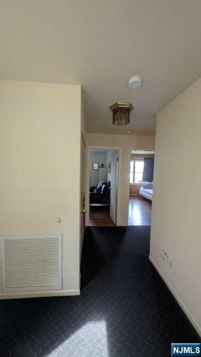 9 Meadowview Ter Unit 9, Fair Lawn, NJ 07410 - hallway featuring baseboards