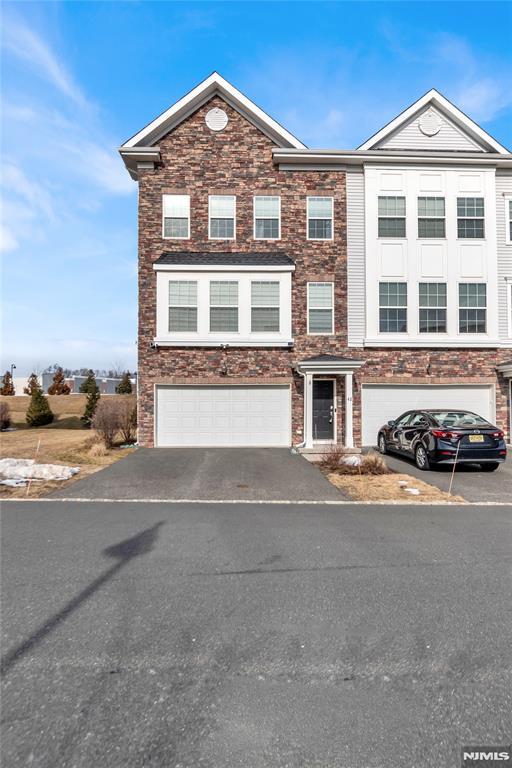 42 Colgate Dr, Morris Township, NJ 07960 - townhome / multi-family property with driveway and a garage