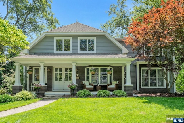 43 Heights Rd, Allendale, NJ 07401 - view of front facade with covered porch, a front yard, and a shingled roof