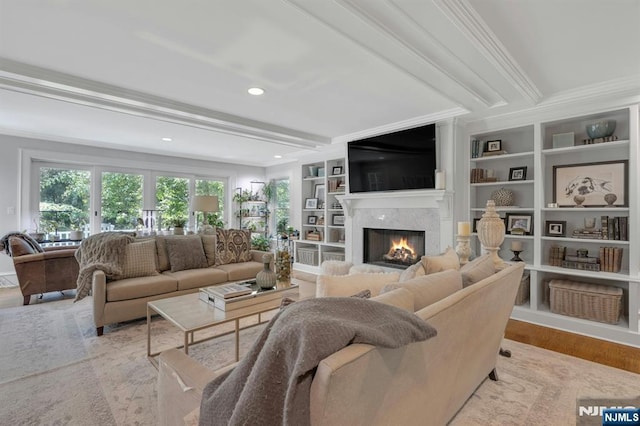 43 Heights Rd, Allendale, NJ 07401 - living area featuring a premium fireplace, beam ceiling, ornamental molding, wood finished floors, and built in features