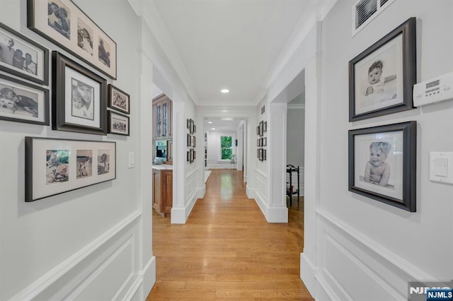 43 Heights Rd, Allendale, NJ 07401 - hallway with crown molding, a decorative wall, light wood-style flooring, and recessed lighting