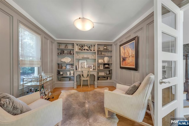 43 Heights Rd, Allendale, NJ 07401 - living area featuring built in features, light wood-style floors, a desk, and crown molding