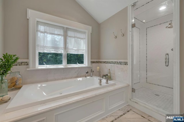 43 Heights Rd, Allendale, NJ 07401 - bathroom featuring a garden tub, a stall shower, marble look tiles, lofted ceiling, and a wainscoted wall