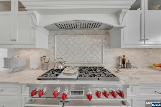 43 Heights Rd, Allendale, NJ 07401 - kitchen with high end stainless steel range oven, white cabinets, glass insert cabinets, and crown molding