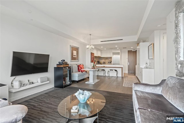 320 Adolphus Ave Unit 702, Cliffside Park, NJ 07010 - living area with a chandelier, wood finished floors, a raised ceiling, and baseboards