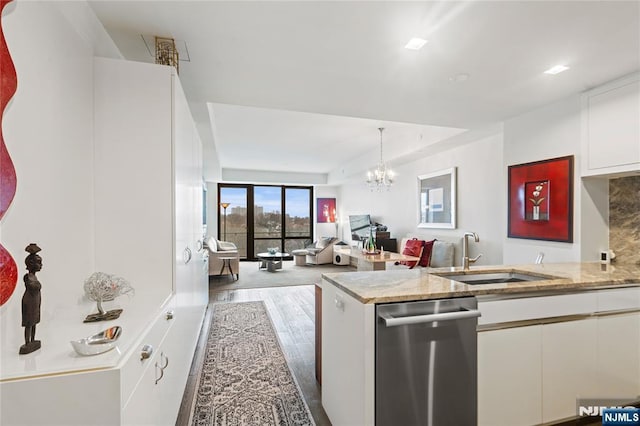 320 Adolphus Ave Unit 702, Cliffside Park, NJ 07010 - kitchen with a sink, white cabinetry, wood finished floors, and light stone countertops