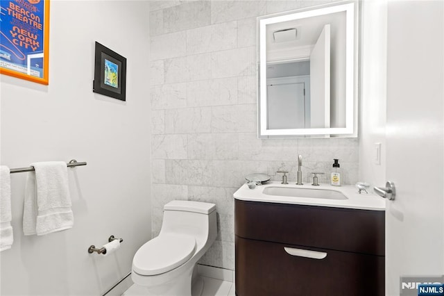 320 Adolphus Ave Unit 702, Cliffside Park, NJ 07010 - half bathroom featuring vanity, toilet, and tile walls