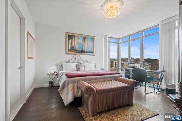 320 Adolphus Ave Unit 702, Cliffside Park, NJ 07010 - bedroom featuring wood-type flooring, floor to ceiling windows, a chandelier, and baseboards