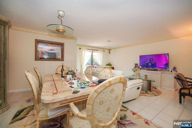 8841 Kennedy Unit 19, North Bergen, NJ 07047 - dining space featuring light tile patterned floors and crown molding