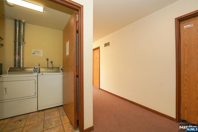 8841 Kennedy Unit 19, North Bergen, NJ 07047 - laundry room featuring separate washer and dryer and baseboards