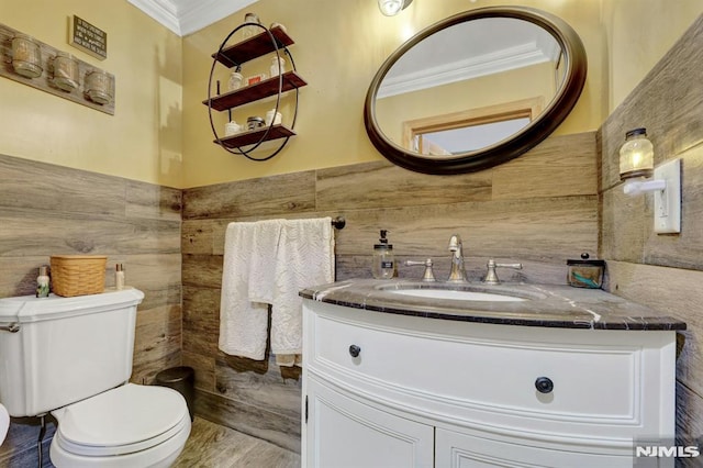 57 Eckerson Ave, Closter, NJ 07624 - half bathroom with ornamental molding, vanity, toilet, tile walls, and wood finished floors