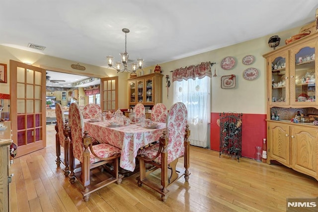 57 Eckerson Ave, Closter, NJ 07624 - dining space with healthy amount of natural light, light wood-style flooring, and a chandelier