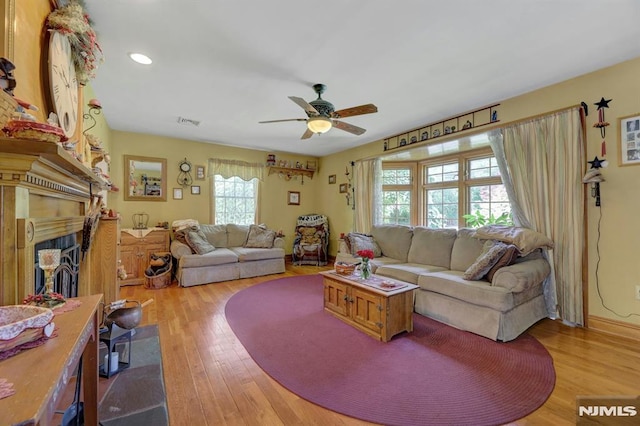57 Eckerson Ave, Closter, NJ 07624 - living room featuring light wood-type flooring, a ceiling fan, a fireplace, and recessed lighting