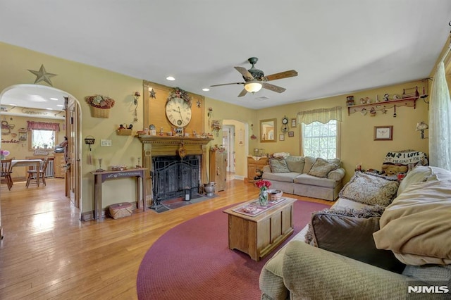 57 Eckerson Ave, Closter, NJ 07624 - living area featuring plenty of natural light, light wood-style flooring, arched walkways, and recessed lighting