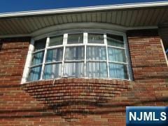 272 E Midland Ave, Garfield, NJ 07652 - view of side of property featuring brick siding