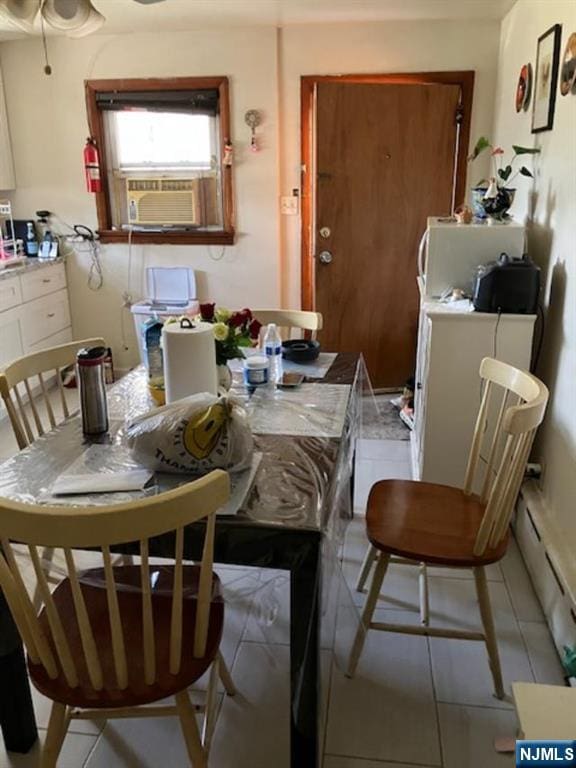 272 E Midland Ave, Garfield, NJ 07652 - dining room with cooling unit, light tile patterned floors, and a baseboard heating unit