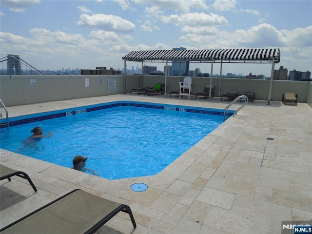 1 Wall St Unit 8-C, Fort Lee, NJ 07024 - community pool featuring a patio area