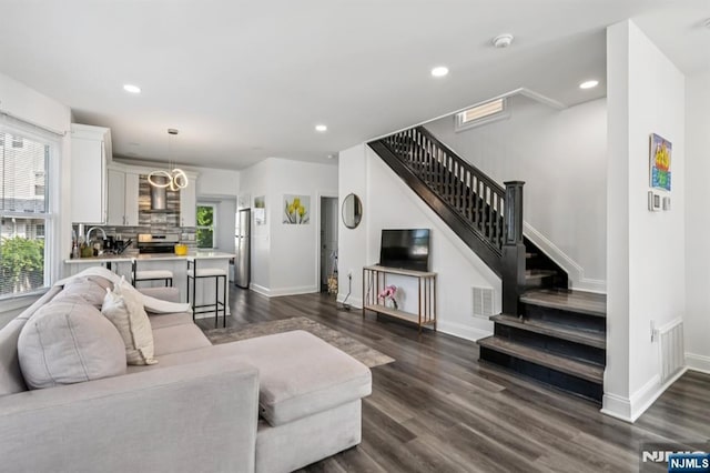 31 Vanderbeck Pl, Hackensack, NJ 07601 - living room featuring stairway, plenty of natural light, dark wood finished floors, baseboards, and recessed lighting