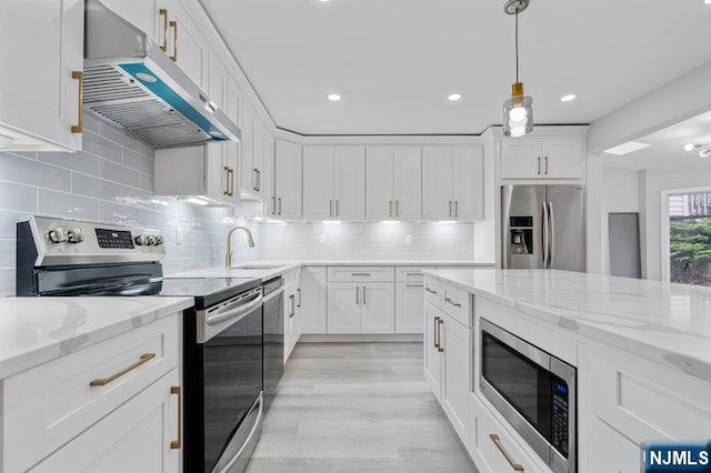 310 Spring Valley Rd, Paramus, NJ 07652 - kitchen featuring appliances with stainless steel finishes, under cabinet range hood, white cabinets, a sink, and recessed lighting