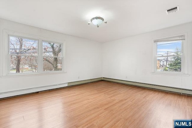 310 Spring Valley Rd, Paramus, NJ 07652 - spare room with healthy amount of natural light and light wood-type flooring