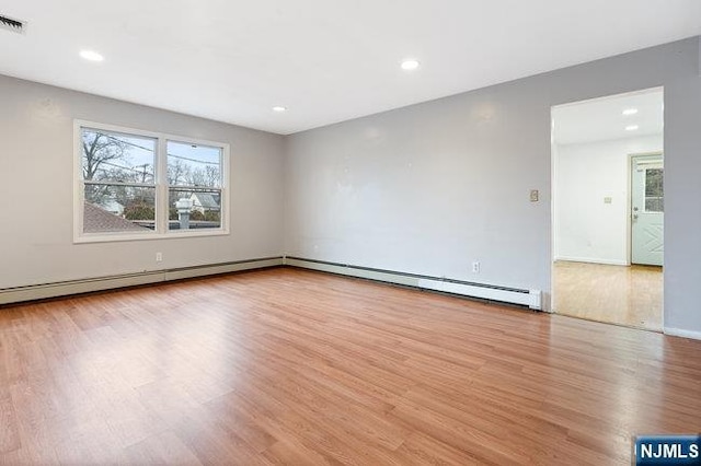 310 Spring Valley Rd, Paramus, NJ 07652 - spare room featuring wood finished floors, recessed lighting, baseboards, and a baseboard heating unit