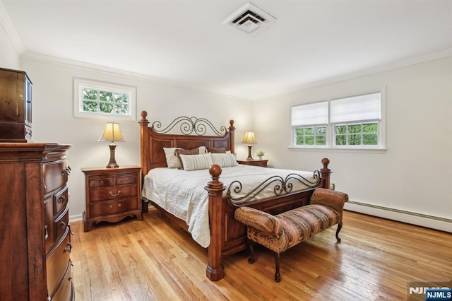 74 Park St, West Caldwell, NJ 07006 - bedroom featuring crown molding, light wood-type flooring, and a baseboard radiator