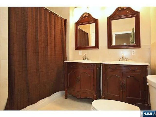 1128 43rd St Unit 1, North Bergen, NJ 07047 - full bath featuring toilet and double vanity