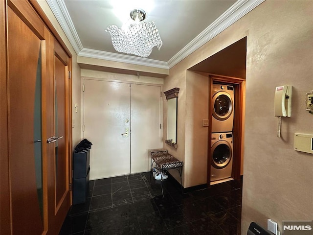 1512 Palisade Ave Unit 17A, Fort Lee, NJ 07024 - foyer with estacked washer and dryer, crown molding, a chandelier, and dark tile patterned floors