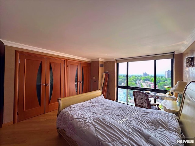 1512 Palisade Ave Unit 17A, Fort Lee, NJ 07024 - bedroom with crown molding and light wood-type flooring