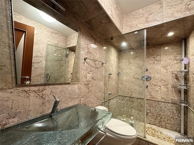 1512 Palisade Ave Unit 17A, Fort Lee, NJ 07024 - bathroom featuring toilet, a shower stall, and a sink