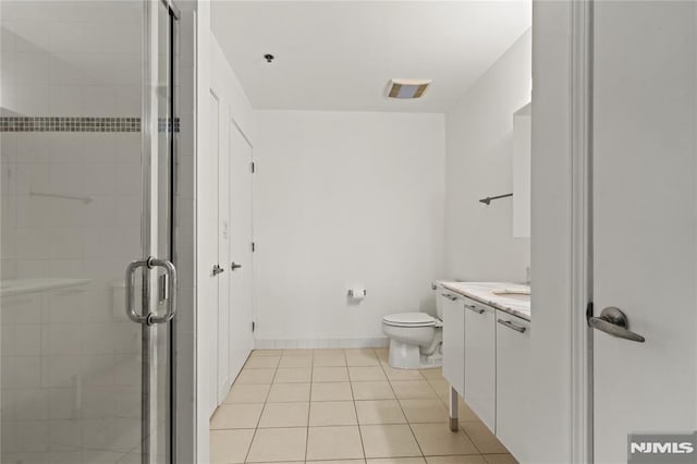 24 Ave At Port Imperial Unit 416, West New York, NJ 07093 - full bath featuring vanity, a shower stall, tile patterned floors, and toilet