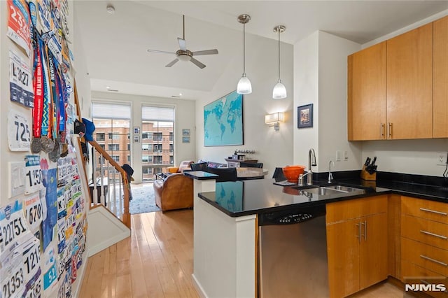 24 Ave At Port Imperial Unit 416, West New York, NJ 07093 - kitchen featuring stainless steel dishwasher, ceiling fan, open floor plan, a sink, and dark countertops