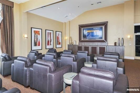 24 Ave At Port Imperial Unit 416, West New York, NJ 07093 - carpeted cinema room with lofted ceiling and baseboards
