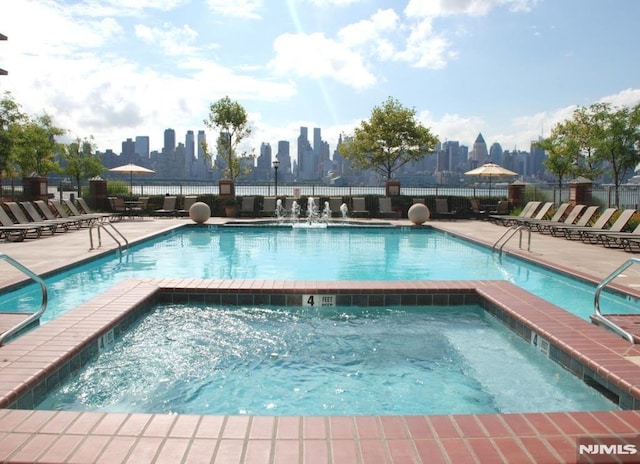 24 Ave At Port Imperial Unit 416, West New York, NJ 07093 - community pool with a hot tub and a view of skyline