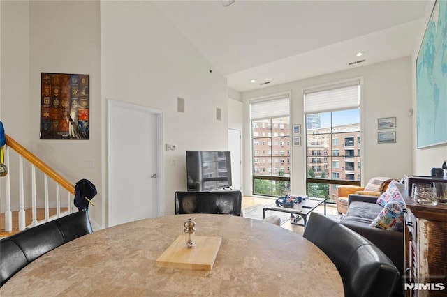 24 Ave At Port Imperial Unit 416, West New York, NJ 07093 - dining area featuring high vaulted ceiling and stairs