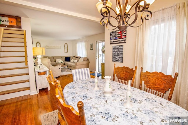 125 Virginia Ave, Dumont, NJ 07628 - dining area featuring stairs, a chandelier, and dark wood-type flooring