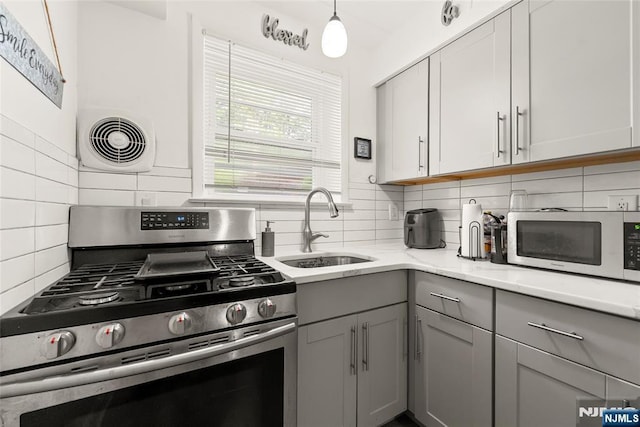 482 Joralemon St Unit G1, Belleville, NJ 07109 - kitchen with stainless steel appliances, a sink, gray cabinetry, and decorative backsplash