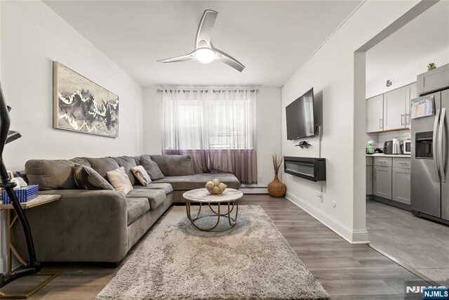 482 Joralemon St Unit G1, Belleville, NJ 07109 - living area with ceiling fan, wood finished floors, and baseboards