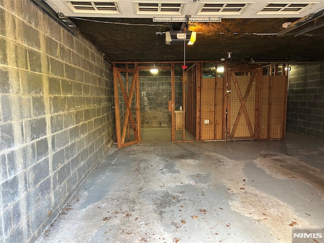 346 Maple Unit 3, Oradell, NJ 07649 - garage featuring concrete block wall and a garage door opener