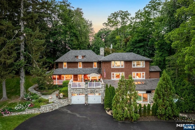 193 S Franklin Tpke, Ramsey, NJ 07446 - shingle-style home with asphalt driveway, a chimney, a porch, and an attached garage