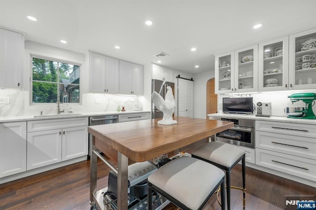 193 S Franklin Tpke, Ramsey, NJ 07446 - kitchen featuring a sink, stainless steel appliances, light countertops, white cabinets, and recessed lighting