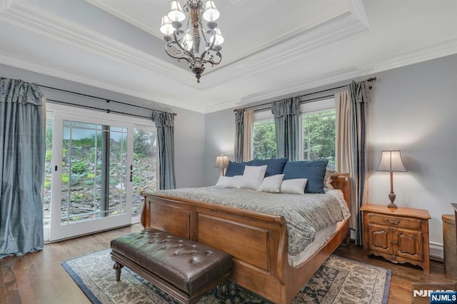 193 S Franklin Tpke, Ramsey, NJ 07446 - bedroom featuring access to exterior, ornamental molding, multiple windows, a raised ceiling, and a chandelier