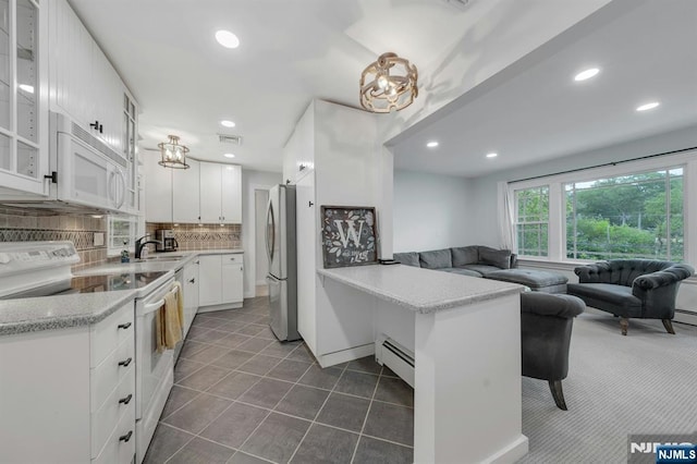 193 S Franklin Tpke, Ramsey, NJ 07446 - kitchen featuring white appliances, baseboard heating, a sink, a peninsula, and open floor plan