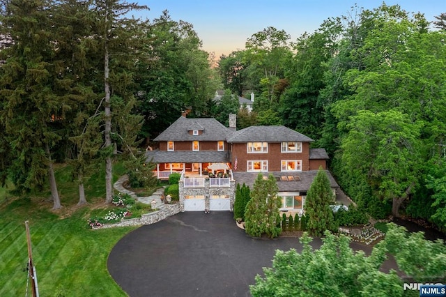193 S Franklin Tpke, Ramsey, NJ 07446 - shingle-style home featuring driveway, a garage, a front lawn, a chimney, and stone siding