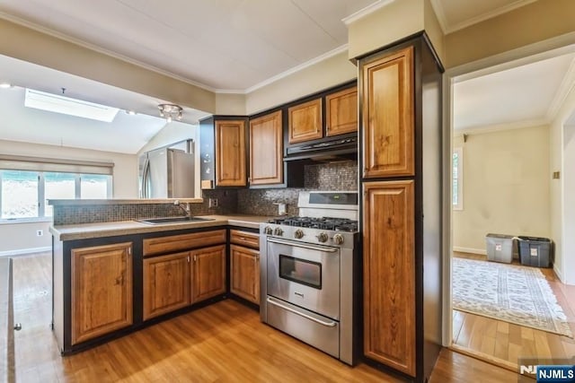 277 Jefferson Ave, Cresskill, NJ 07626 - kitchen with stainless steel range with gas cooktop, a sink, range hood, brown cabinetry, and ornamental molding
