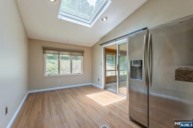 277 Jefferson Ave, Cresskill, NJ 07626 - spare room with lofted ceiling, light wood-type flooring, a skylight, baseboards, and recessed lighting