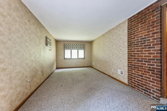 277 Jefferson Ave, Cresskill, NJ 07626 - spare room featuring carpet, baseboards, and an AC wall unit