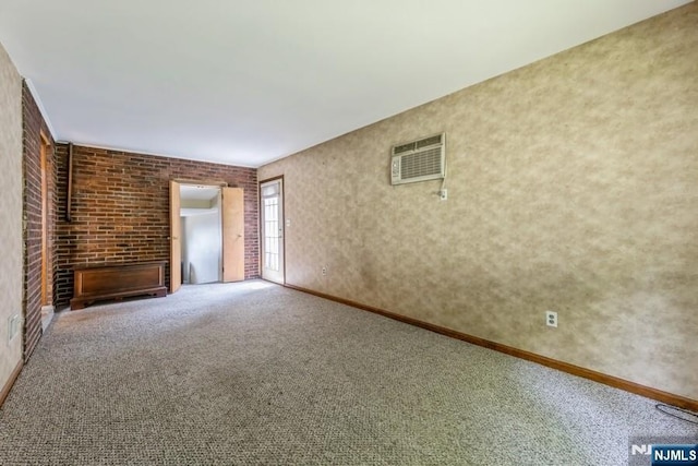 277 Jefferson Ave, Cresskill, NJ 07626 - unfurnished living room featuring an AC wall unit, carpet floors, baseboards, and brick wall