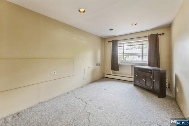 277 Jefferson Ave, Cresskill, NJ 07626 - unfurnished living room featuring a baseboard heating unit, light colored carpet, and recessed lighting