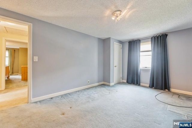 277 Jefferson Ave, Cresskill, NJ 07626 - carpeted empty room with a textured ceiling and baseboards